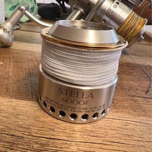 Shimano Stella 6000F Silver with extra Spool with Gold Trim